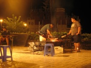 Grilling veal for the food trucks on the Papeete waterfront, Tahiti, 2007