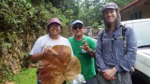 Chelsea, José Román, David, and a Coccoloba pubescens leaf, Bosque Estatal de Guajataca, Puerto Rico (May 2023)
